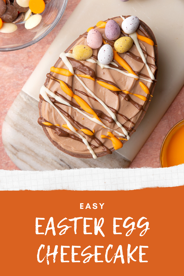 An Easter Egg cheesecake, shown from above, decorated with drizzled chocolate and mini eggs. The caption reads: Easy Easter egg cheesecake.