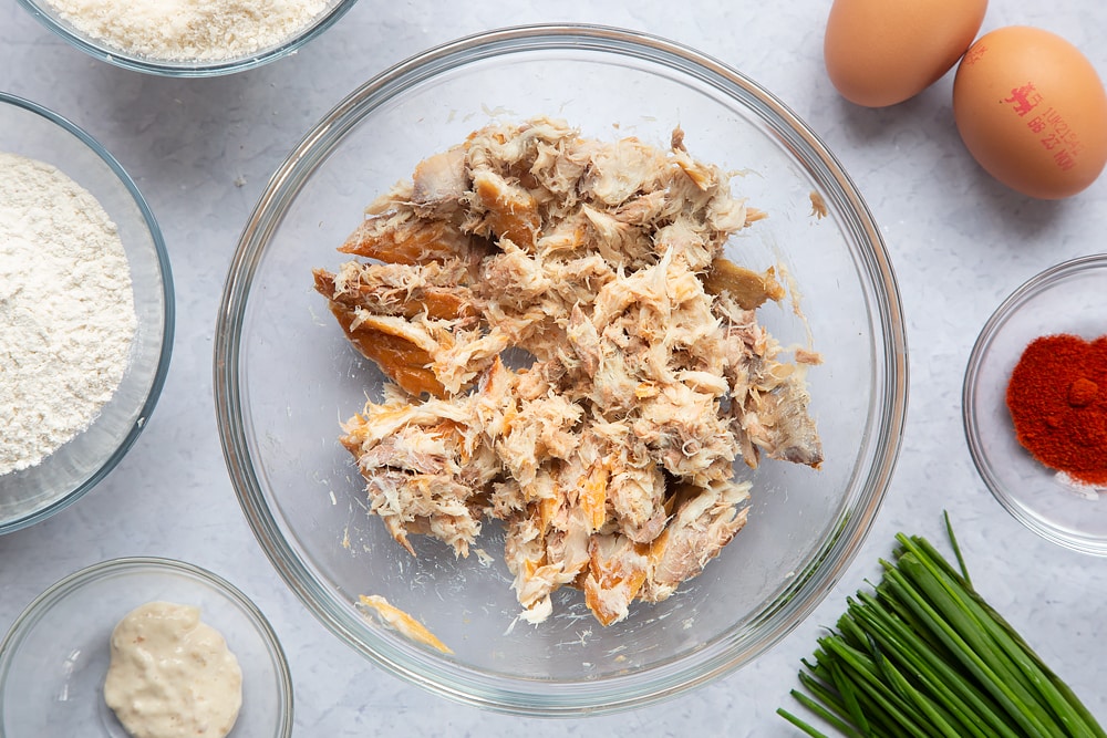 The bowl of mackerel which has been mashed down with a fork.