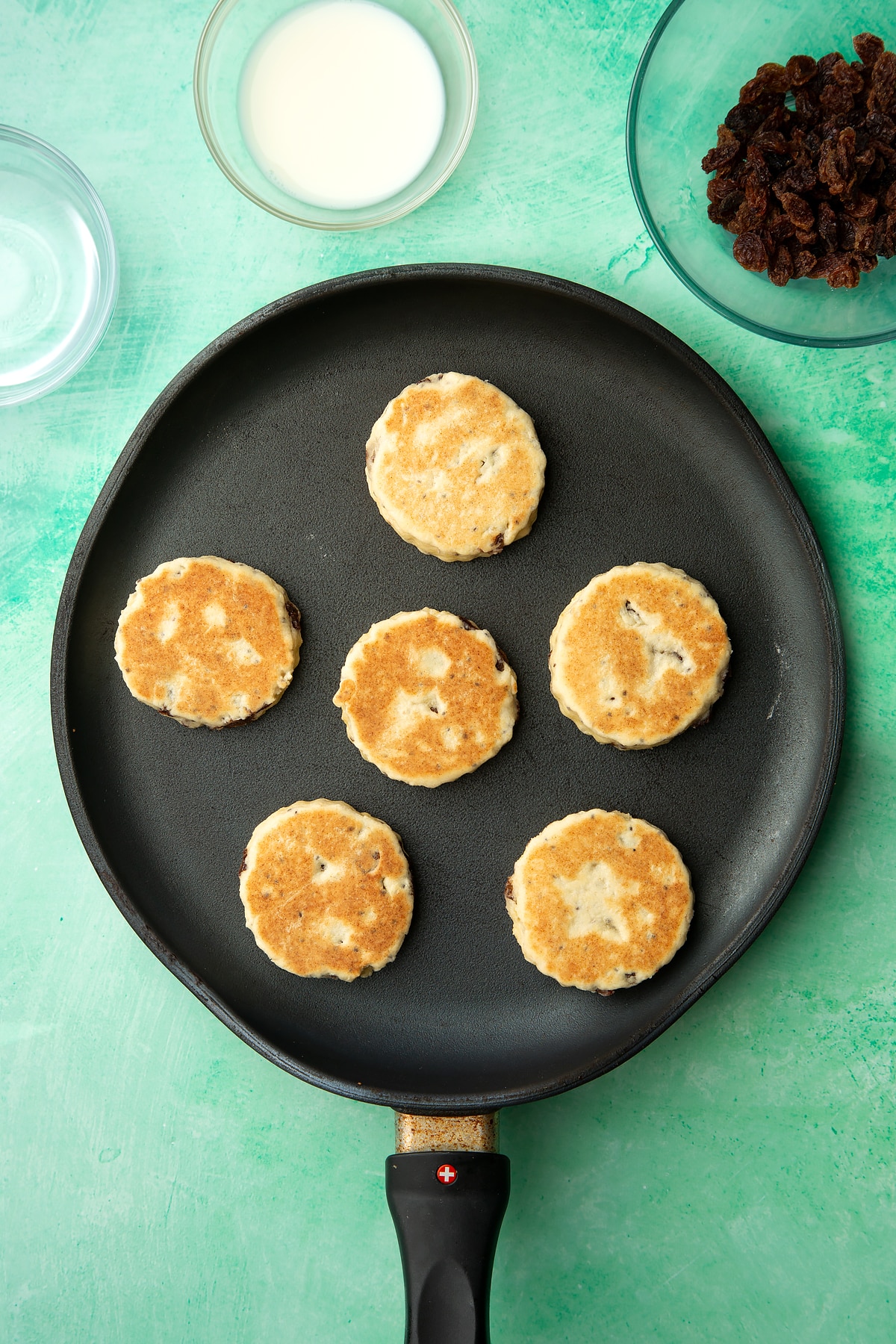 Cooked Vegan Welsh cakes in a pan.